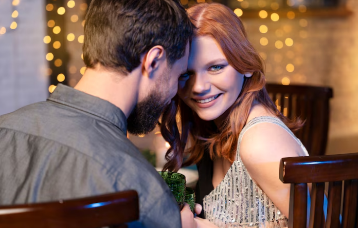 Adult couple talking together at a table